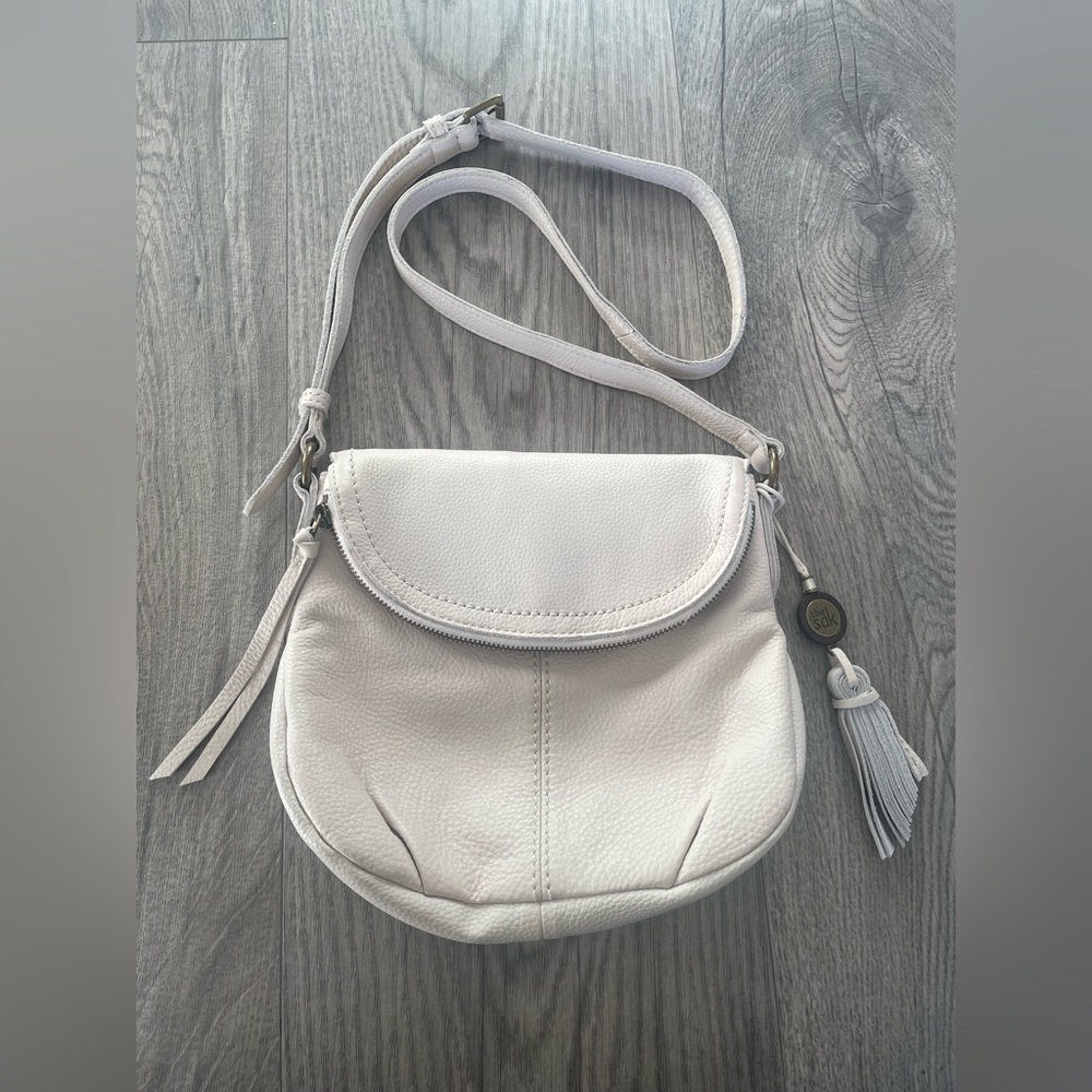 The Sak cream colored leather crossbody bag purse